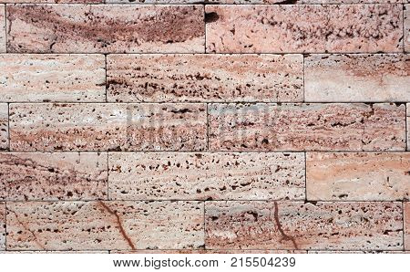 Facing tile from travertine with a smooth surface texture