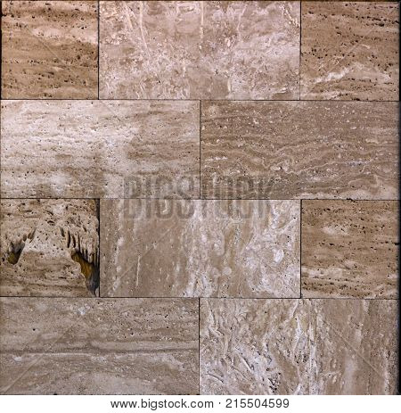 Facing tile from travertine with a smooth surface texture