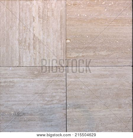 Facing tile from travertine with a smooth surface texture