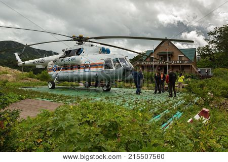 Kamchatka Peninsula, Russia - August 12, 2016: Helicopter landed on the ground near reserve administration in Valley of Geysers. Kronotsky Nature Reserve on Kamchatka Peninsula.