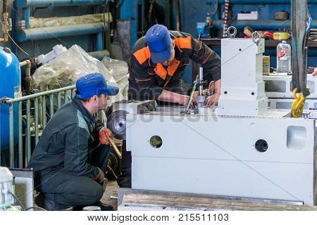 LIPETSK, RUSSIA - JUNE 15, 2017: Lipetsk Machine Tool Plant. Locksmiths are working on assembling a new metal-cutting machine.