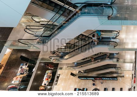 Graz, Austria - August 11, 2017: High angle view of escalators in shopping center in Graz