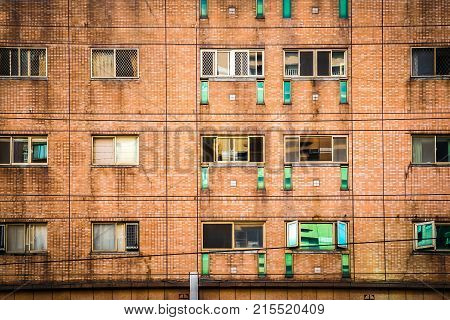 Brick wall with vintage style and light green window., Taipei, Taiwan.