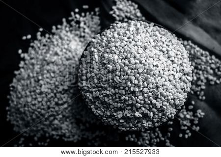 Vigna mungo, urad, Split Black gram, in a clay bowl.
