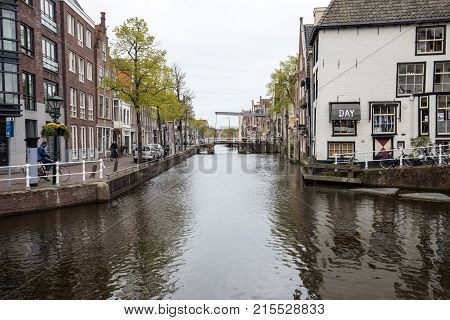 ALKMAAR NETHERLANDS - APRIL 21 2017: Historic old town of Alkmaar North Holland Netherlands typical canal houses