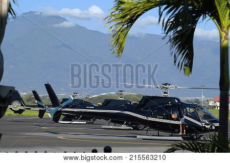 Tour Helicopter awaiting passengers at Kahului Airport Maui HI