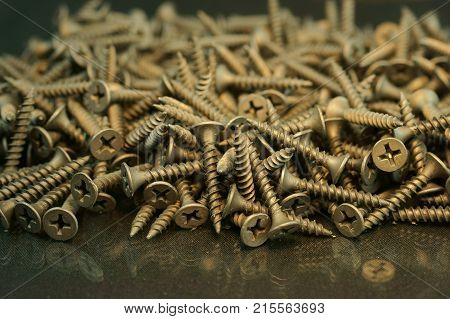 self tapping metal screw with hex head on a white background