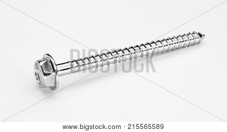 self tapping metal screw with hex head on a white background