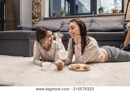 Family Drinking Tea At Home