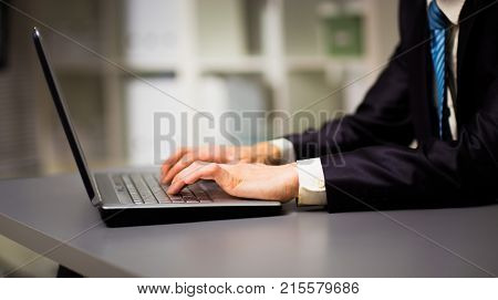 Person Typing on a modern laptop in an office