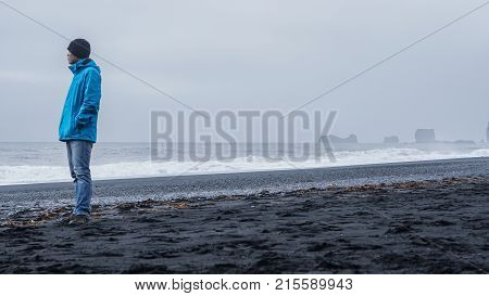 Asina Advanture Man  At Iceland Black Beach With Copy Space