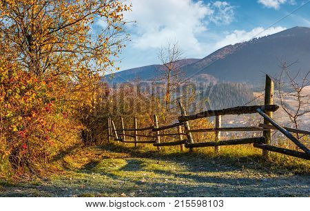 Autumn Rural Scenery With Fence On Hillside
