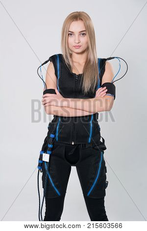Beautiful Blonde In Electric Muscular Suit For Stimulation