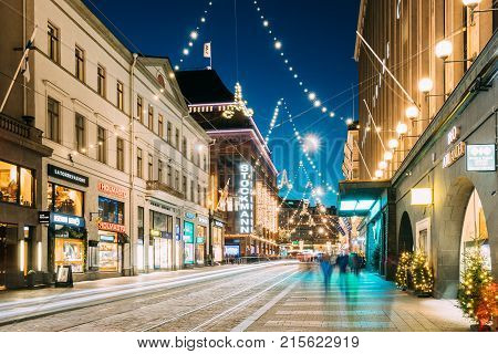 Helsinki, Finland - December 6, 2016: Night View Of Aleksanterinkatu Street With Railroad In Kluuvi District In Evening Christmas Xmas New Year Festive Illumination.