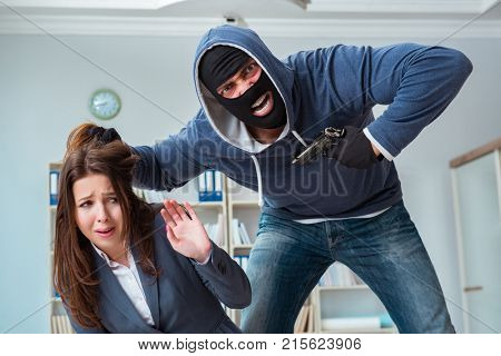 Criminal taking businesswoman as hostage in office