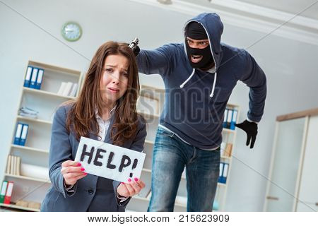 Criminal taking businesswoman as hostage in office