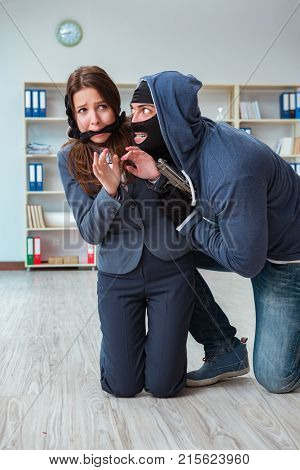 Criminal taking businesswoman as hostage in office