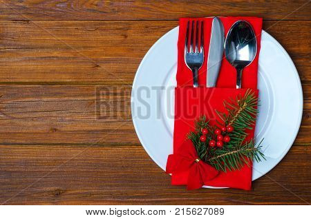 Christmas Plate And Appliances On A Wooden Table Top View With Copy Space.