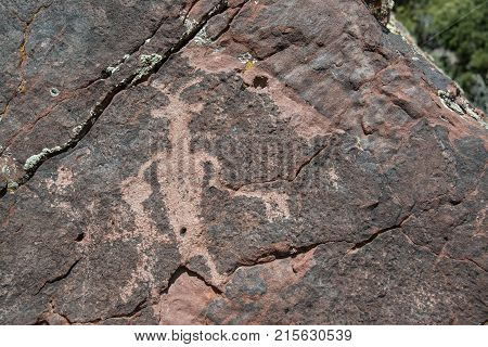 Petroglyphs are ancient mysterious rock drawings from Fremont people at Irish Canyon in Colorado