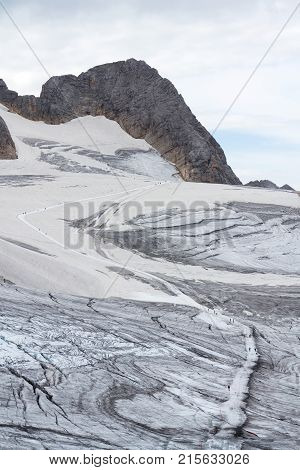 People Hiking On Dachstein Glacier Near Hunerkogel Station, Austrian Alps