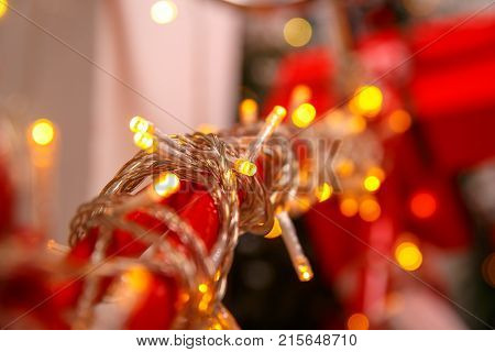 Colorful glowing Christmas lights wiyh bokeh. Holiday background