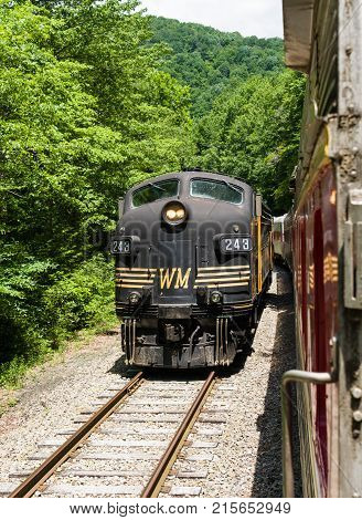 ELKINS, WEST VIRGINIA - JUNE 19, 2016: Tygart Flyer on steep trip into mountains of West Virginia by Durbin and Greenbrier Vallery Railroad
