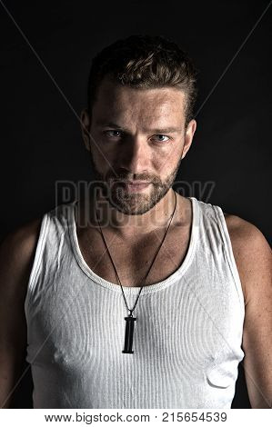 Man With Unshaven Face In Studio.