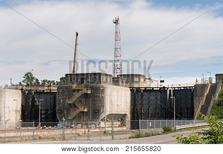 NIAGARA FALLS, CANADA - JUNE 30, 2016: Large metal gates of industrial shipping locks on Welland Canal climbing Niagara Escarpment