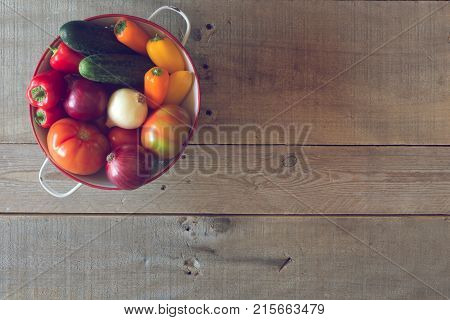 Fresh vegetables on a wooden background. Top view