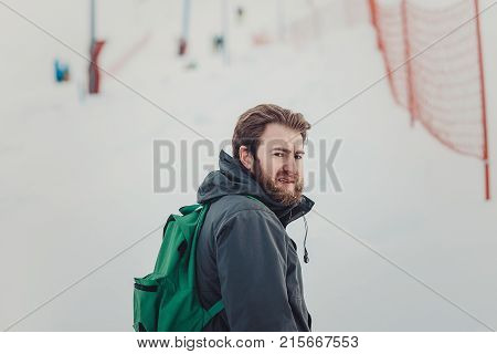 Snowboarder In A Black Helmet Riding On A Snowy Track.