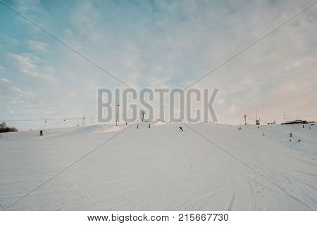 Snowboarder In A Black Helmet Riding On A Snowy Track.