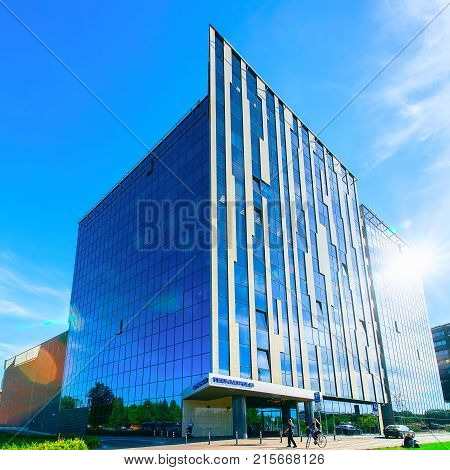 Vilnius Lithuania - June 6 2017: People at Technopolis modern office building skyscraper in a new business quarter in Baltupiai district Vilnius Lithuania