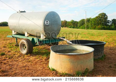 Water trough for drinking for cows cattle at the field Franche Comte France.