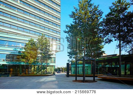 Comfort public zone at the entrance into modern steel and glass skyscraper building.