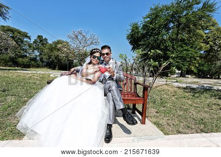 Asian couple photographed before marriage is Pre-wedding on Koh Si Chang Island Popular locations in the Chonburi province at Thailand.