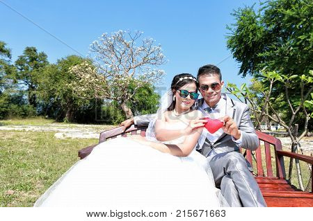 Asian couple photographed before marriage is Pre-wedding on Koh Si Chang Island Popular locations in the Chonburi province at Thailand.