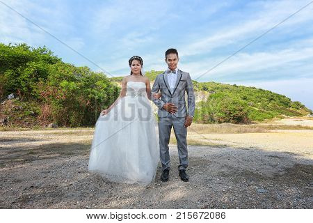 Asian couple photographed before marriage is Pre-wedding on Koh Si Chang Island Popular locations in the Chonburi province at Thailand.