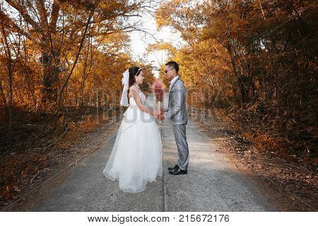 Asian couple photographed before marriage is Pre-wedding on Koh Si Chang Island Popular locations in the Chonburi province at Thailand.