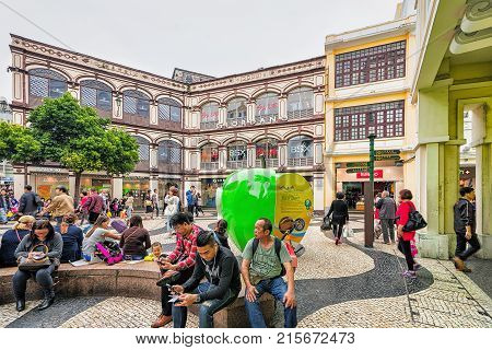 Macao China - March 8 2016: People relaxing on Senado Square in Historical old city center in Macao China. People on the background