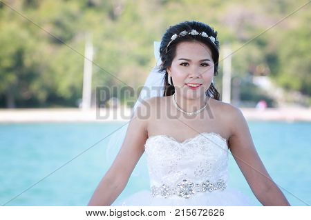 Asian bride photographed before marriage is Pre-wedding on Koh Si Chang Island Popular locations in the Chonburi province at Thailand.