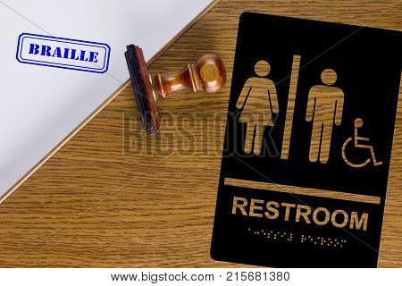 Sign of Restroom sign Braille. Poster with a stamp.