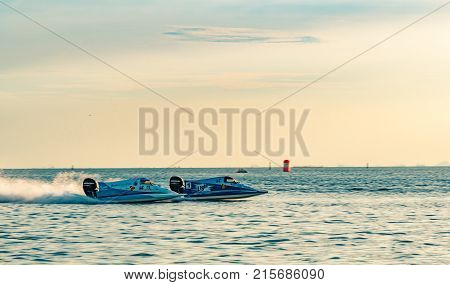 CHONBURI THAILAND-NOVEMBER 25 2017 : Two F5 boat with beautiful sky and sea in Bangsaen Power Boat 2017 at Bangsaen beach in Thailand