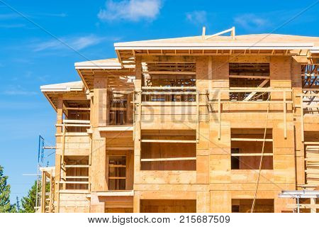 New apartment building under construction on sunny day on blue sky background
