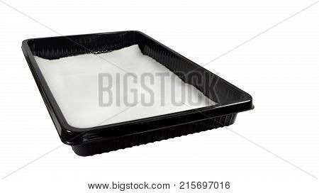 Assembling the device to facilitate the care of indoor plants. Black plastic pallet with a piece of capillary mat from white synthetic felt laid on the bottom. Isolated on white background
