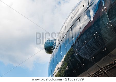 Graz, Austria - August 11, 2017: Kunsthaus Graz is a musem of Art. Low angle view a cloudy day