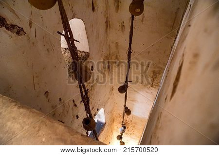 Close up wooden wheel part of watre supply system in historical Amer Fort in India