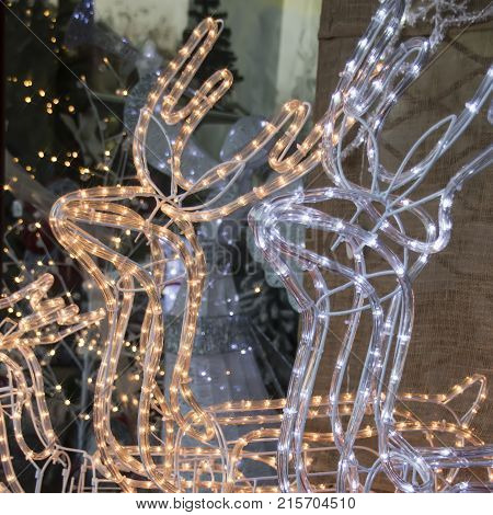 Holiday Lights Christmas deers. Happy New Year and Merry Christmas greeting card 2018.