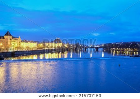 Prague, Czech Republic - November, 23, 2017: night view from the Charles bridge to the Vitava embankment in the center of Prague