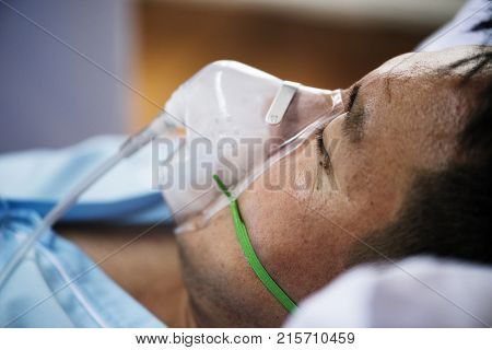 A sick Asian man in a hospital