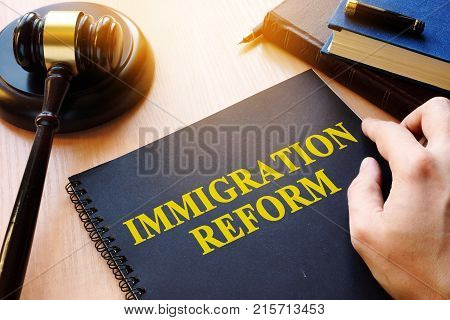 Immigration reform and gavel on a desk.